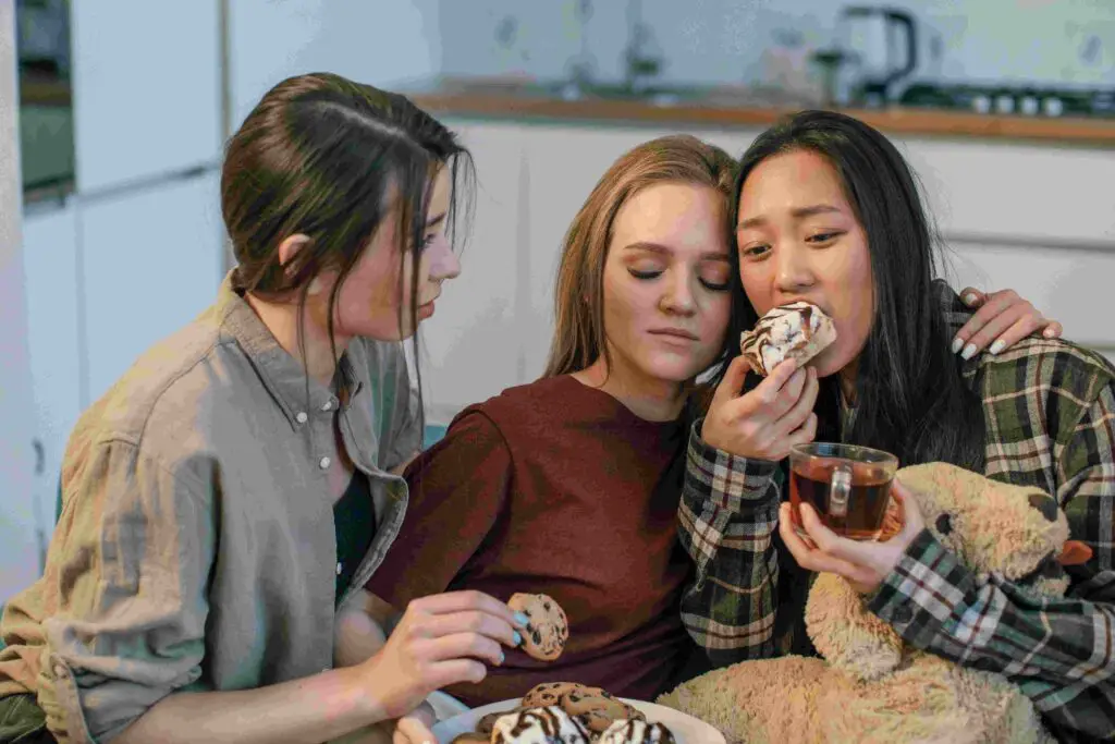 Group of friends comforting one girl